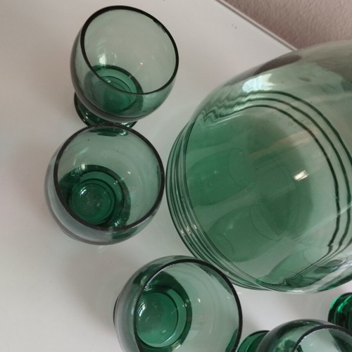 Vintage decanter set with 5 green glass shot glasses used