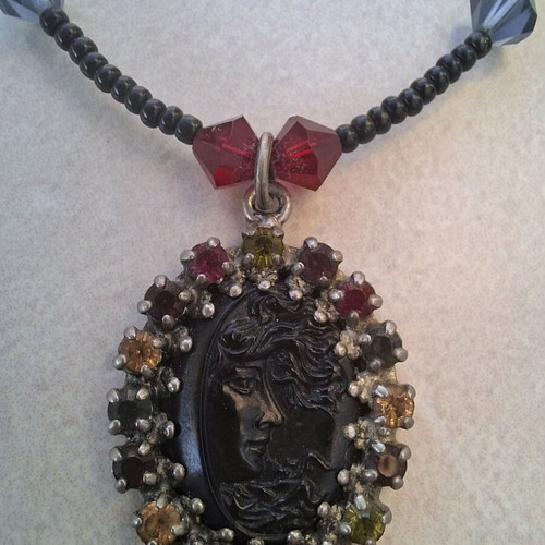 Necklace black with colorful stones and embossed face vintage like new