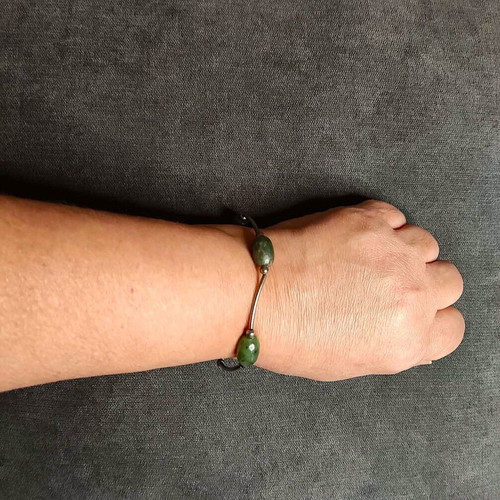 Minimal bracelet with green stones and silver details like new