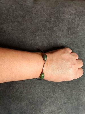 Minimal bracelet with green stones and silver details like new
