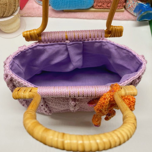 Handmade lilac crochet handbag with wooden handles and eco leather base