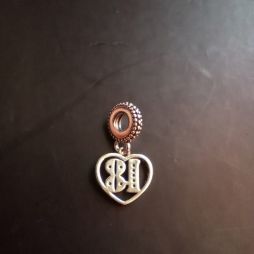 Pandora charm 18 years old, like new, silver