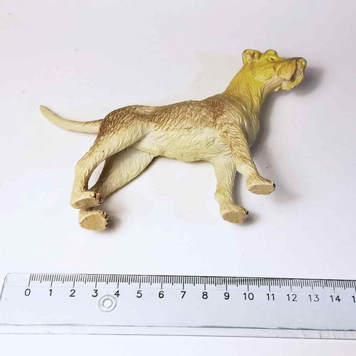Dog plastic figure used with scratches and marks