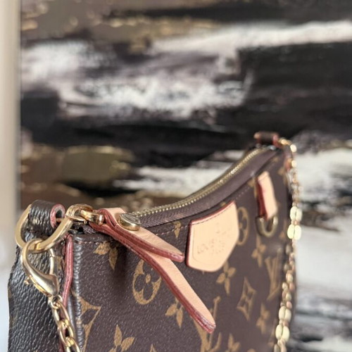 Louis Vuitton small handheld bag, leather, elegant