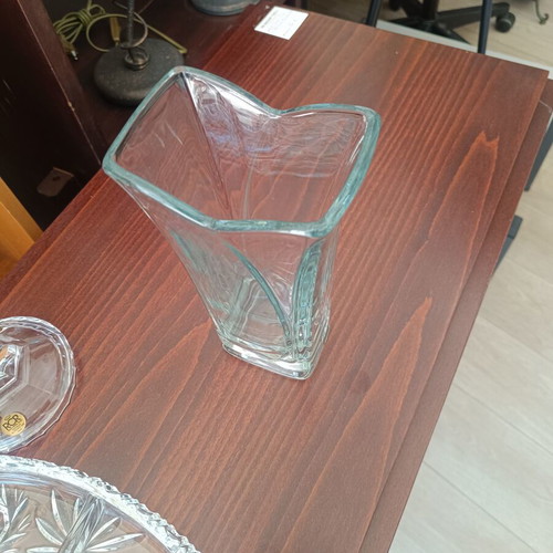 Glass decorative vase with modern wavy design, used