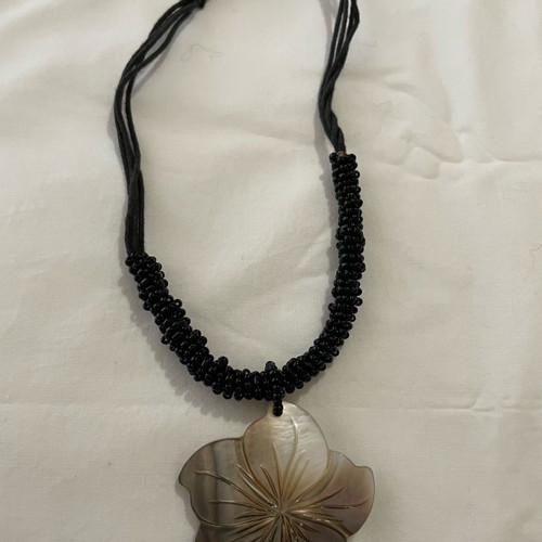 Vintage necklace with black seed beads and MOP flower pendant used