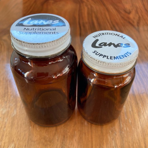 Lanes Nutritional Supplements ζευγάρι καφέ γυάλινων μπουκαλιών μεταχειρισμένο