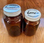 Lanes Nutritional Supplements ζευγάρι καφέ γυάλινων μπουκαλιών μεταχειρισμένο