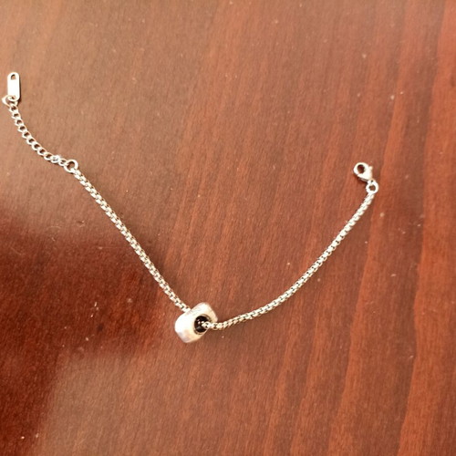 Chain bracelet with charm like new, silver color