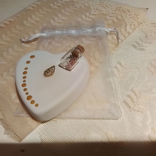 Wedding favors scented plaster hearts in organza pouch with glass bottles