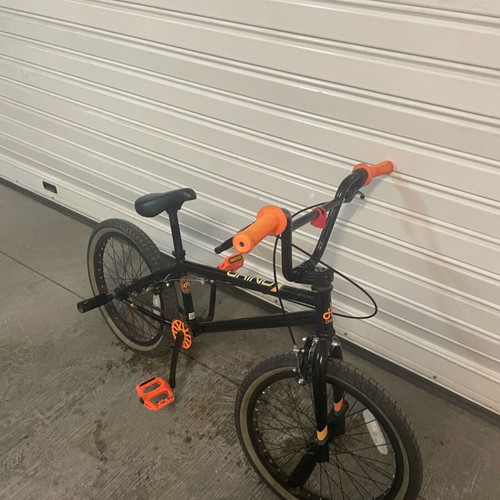 BMX bicycle like new, black, with extra metal pegs for tricks
