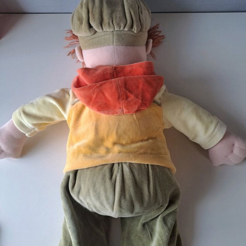 Cloth doll with hat and orange details like new