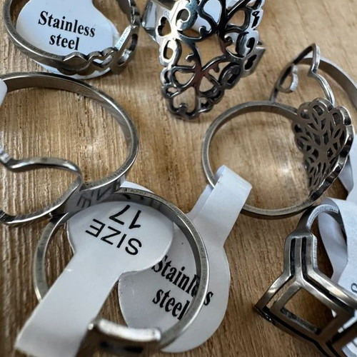 Steel ring set with hearts, geometric and floral designs