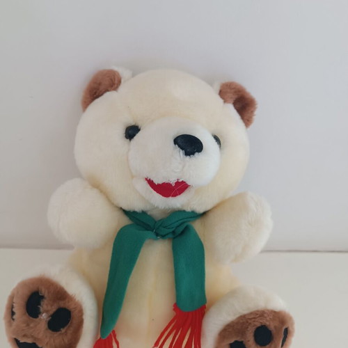 Plush teddy bear with green scarf, ecru