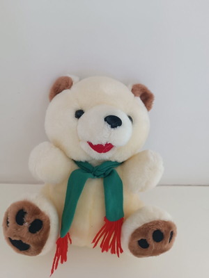 Plush teddy bear with green scarf, ecru