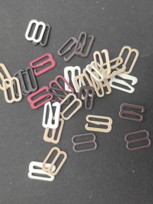 Clothing length adjuster sliders and hooks used for sewing