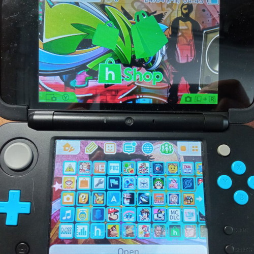 Nintendo 2DS XL modded like new with handgrip, charger, and 64GB micro SD