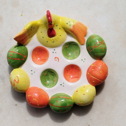Chicken egg holder with colorful eggs in porcelain new for festive table