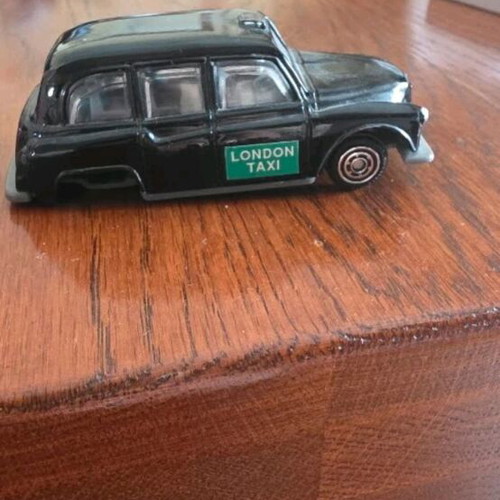 Collectible toy cars used, London Taxi and Valletta bus