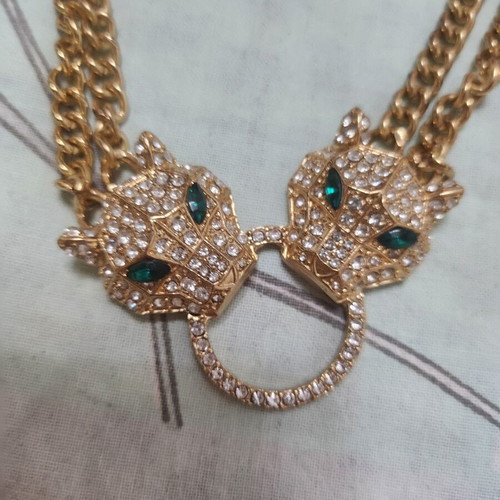 Gold-tone tiger earrings and necklace set with rhinestones