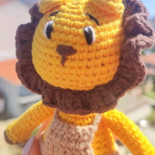 Crocheted lion toy handmade new with beige overalls