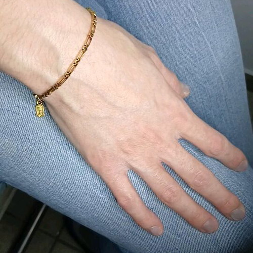Gold steel chain bracelet with charm