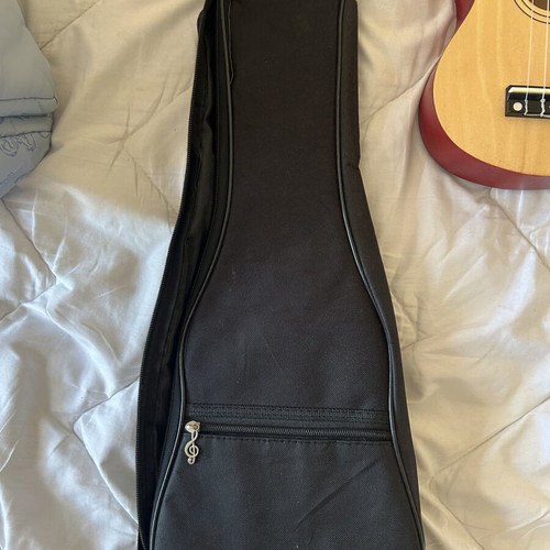Ukulele like new with torn bag