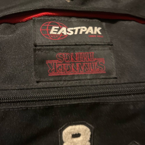 Eastpak Stranger Things backpack used, black with stain
