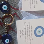 Set of 2 blue evil eye keychains with card and transparent pouch