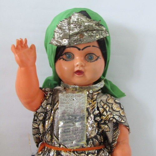 Vintage souvenir doll with traditional oriental costume used