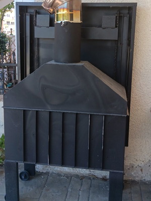 Cast iron fireplace used, Nef brand with sliding safety door