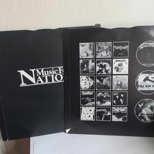 The Singles Album double vinyl used, heavy metal