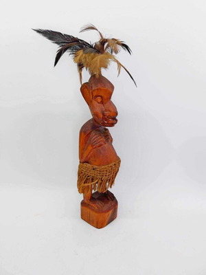 Vintage tribal hand-carved wooden figurine with feathers and raffia skirt like new