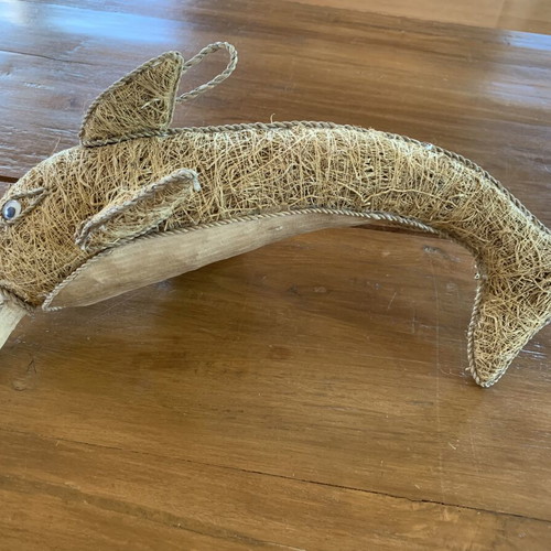 Handmade decorative dolphin made of grass