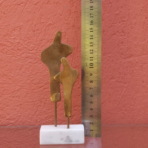 Brass sculpture used on marble base