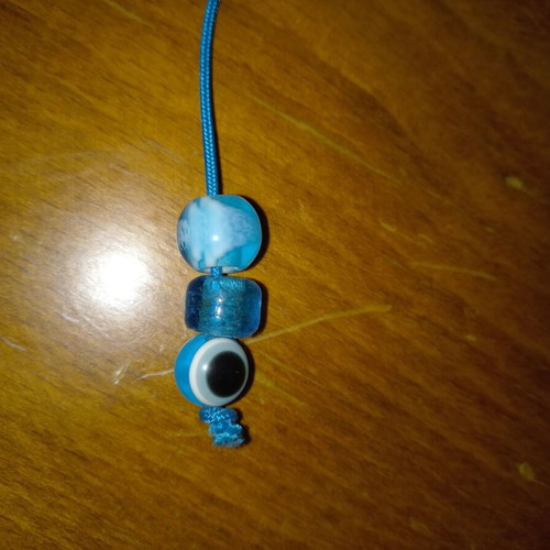 Small blue worry beads with eye stones