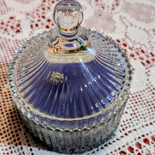 Scented candle in glass fondue pot, lavender aroma
