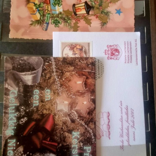 Vintage festive album with 80 cards like new