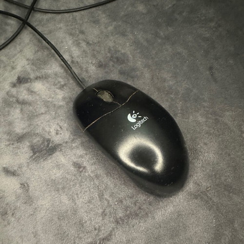 Logitech computer mouse used with free mouse pad