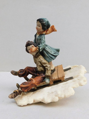 Statue children on sled vintage signed