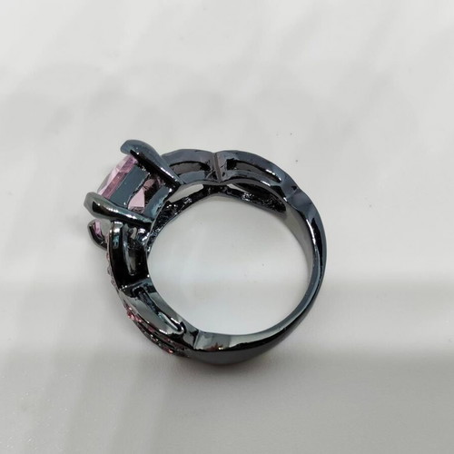 Ring with pink crystal and black base like new