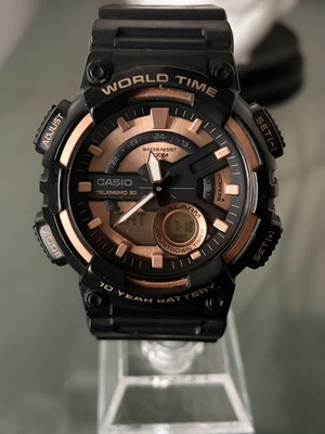 Casio AEQ-110W-1A3VDF watch used, black rubber strap, rose gold details