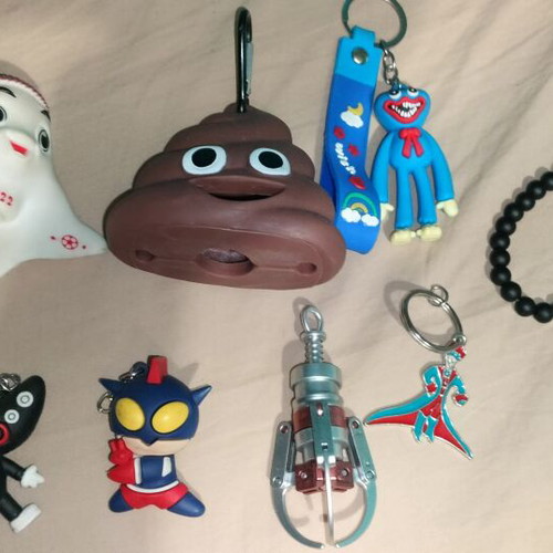 Keychains like new, assorted characters and black bracelet
