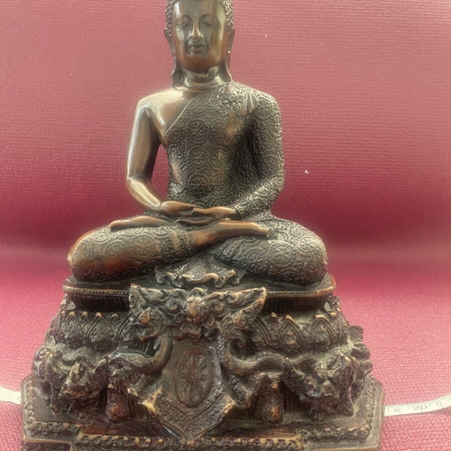 Thai Buddha statue with detailed embossed decoration
