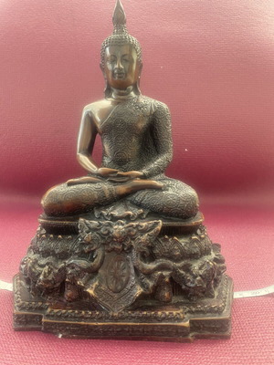 Thai Buddha statue with detailed embossed decoration