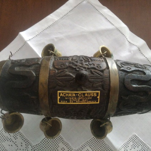 Antique barrel used with brass cups and carvings