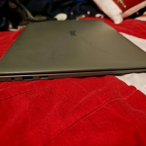 Quest Slimbook Plus 14.1" FHD laptop used with mouse and bag