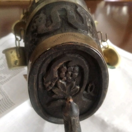 Antique barrel used with brass cups and carvings