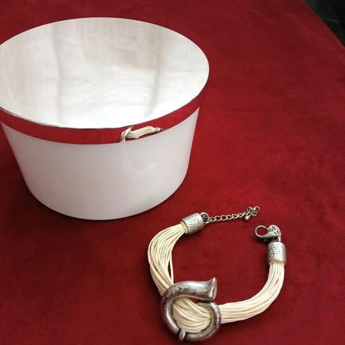 Bracelet with beige cords and metal elements like new