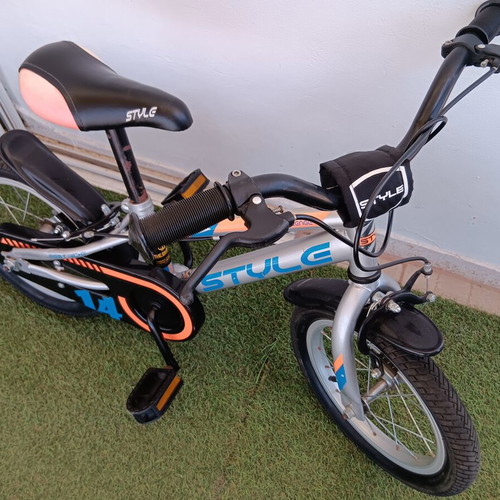 Boy's city bike silver with blue and orange designs like new with training wheels